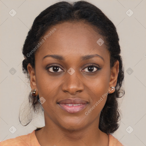 Joyful black young-adult female with medium  brown hair and brown eyes