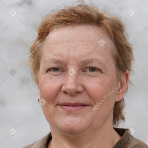 Joyful white adult female with short  brown hair and grey eyes