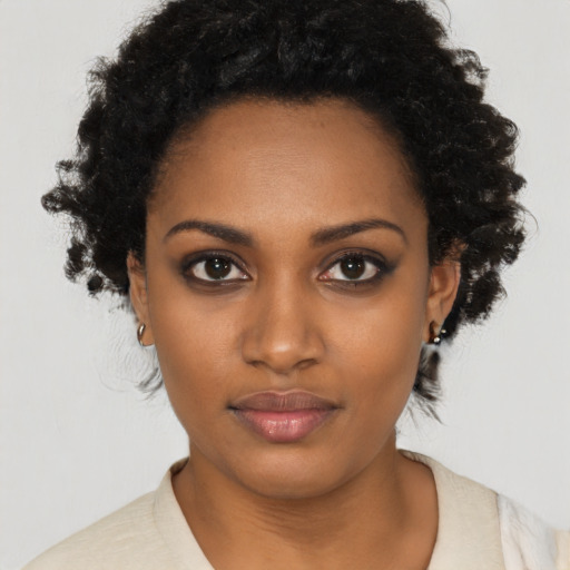Neutral black young-adult female with short  black hair and brown eyes
