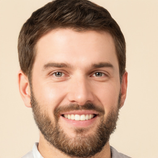 Joyful white young-adult male with short  brown hair and brown eyes