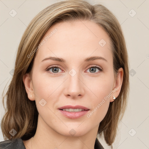 Joyful white young-adult female with medium  brown hair and blue eyes