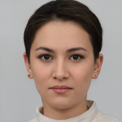 Neutral white young-adult female with short  brown hair and brown eyes