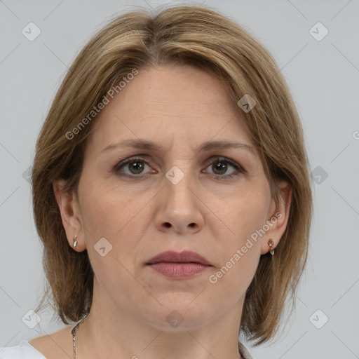 Joyful white adult female with medium  brown hair and grey eyes