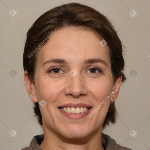 Joyful white adult female with medium  brown hair and brown eyes