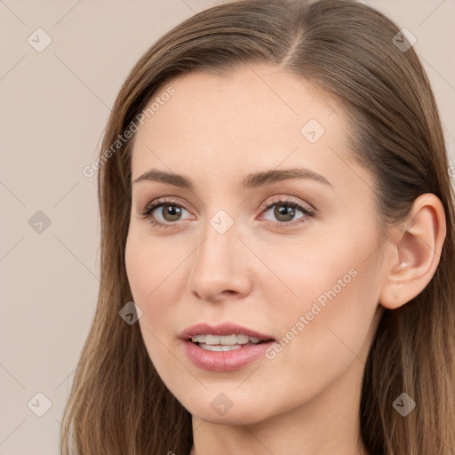 Joyful white young-adult female with long  brown hair and brown eyes