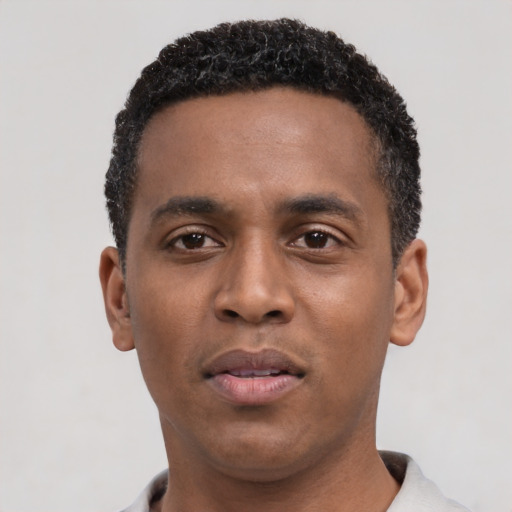 Neutral black young-adult male with short  black hair and brown eyes