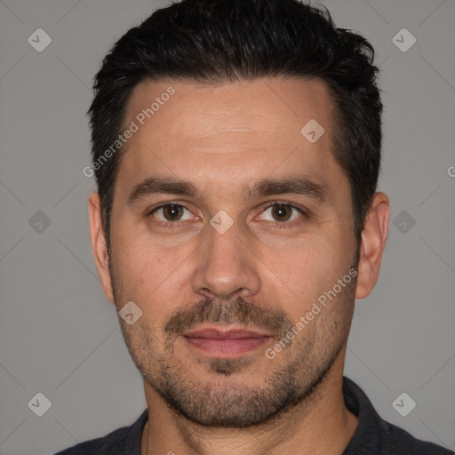 Joyful white adult male with short  black hair and brown eyes