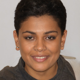 Joyful black young-adult female with short  brown hair and brown eyes