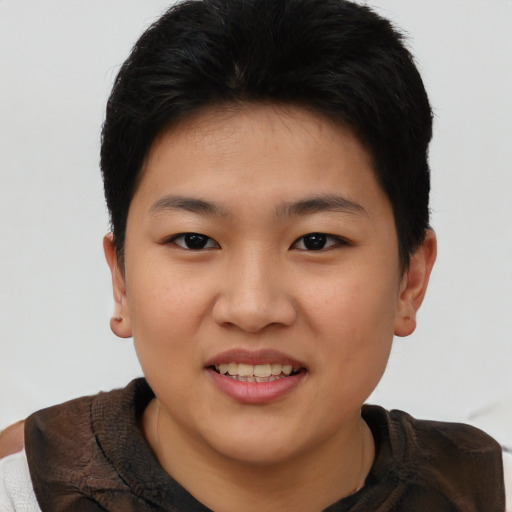 Joyful asian young-adult female with short  black hair and brown eyes
