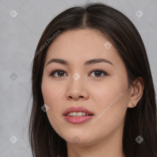 Joyful asian young-adult female with long  brown hair and brown eyes