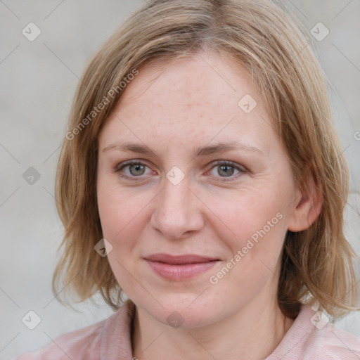 Joyful white young-adult female with medium  brown hair and blue eyes