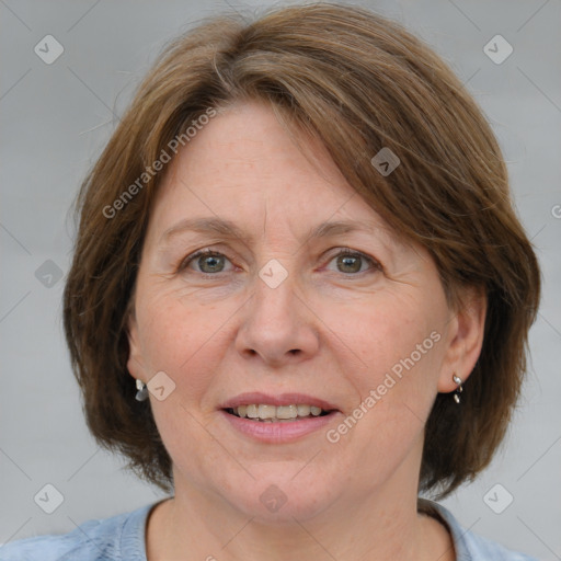 Joyful white adult female with medium  brown hair and blue eyes