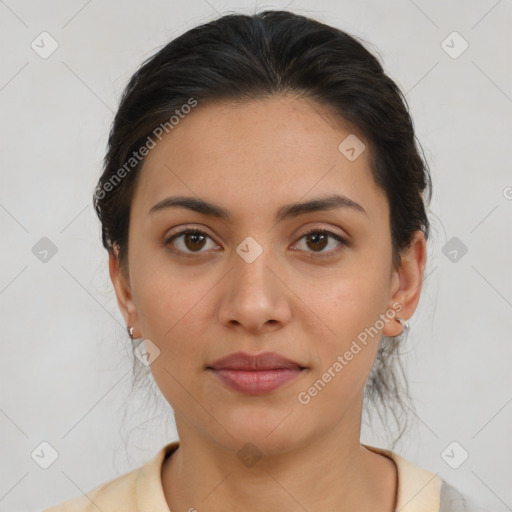 Joyful latino young-adult female with medium  brown hair and brown eyes