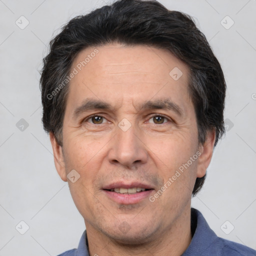 Joyful white adult male with short  black hair and brown eyes