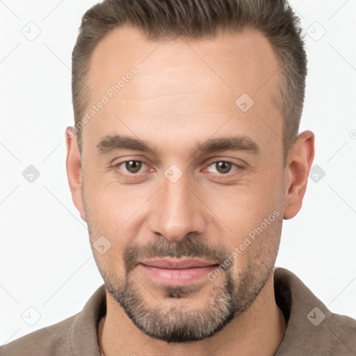 Joyful white adult male with short  brown hair and brown eyes