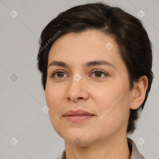 Joyful white adult female with medium  brown hair and brown eyes