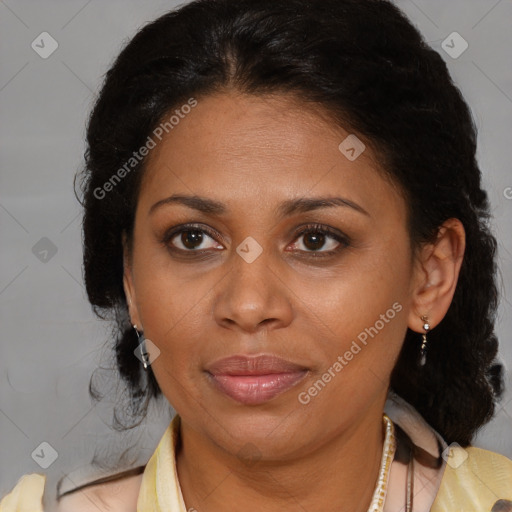 Joyful black adult female with medium  brown hair and brown eyes