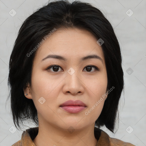 Joyful asian young-adult female with medium  black hair and brown eyes