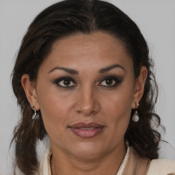 Joyful black adult female with medium  brown hair and brown eyes