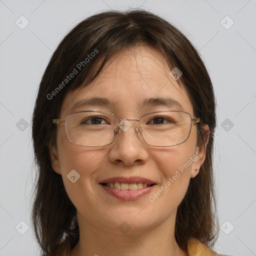 Joyful white adult female with medium  brown hair and brown eyes