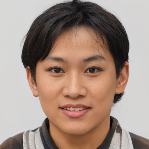 Joyful asian young-adult female with short  brown hair and brown eyes