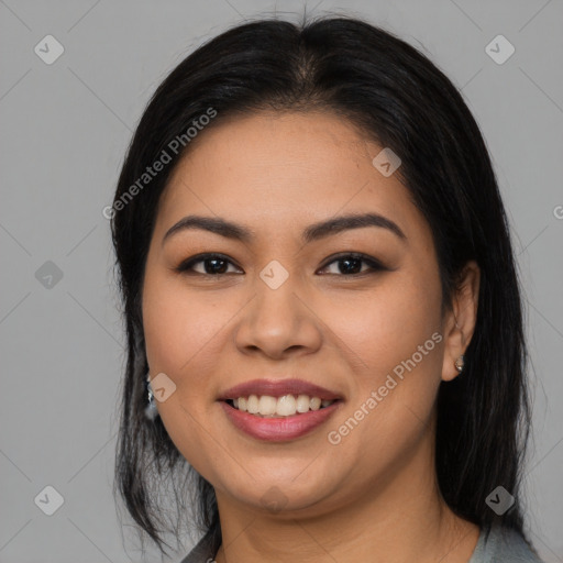 Joyful latino young-adult female with long  black hair and brown eyes