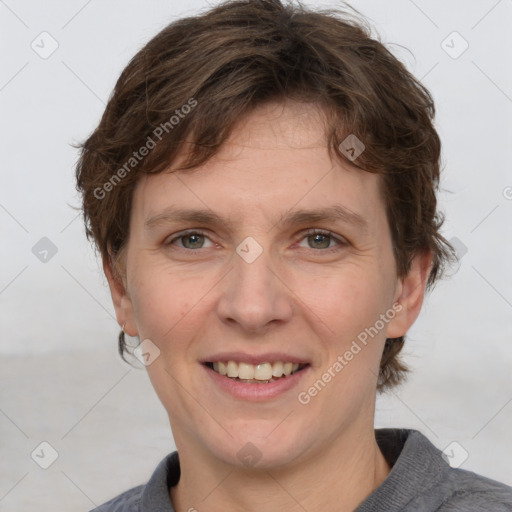 Joyful white adult female with short  brown hair and grey eyes