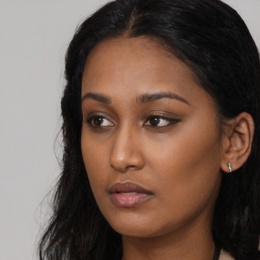 Neutral black young-adult female with long  black hair and brown eyes
