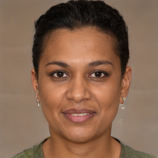 Joyful black young-adult female with short  brown hair and brown eyes