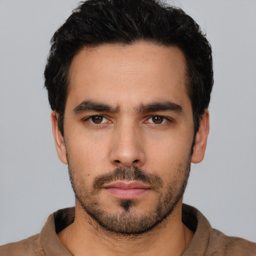 Neutral white young-adult male with short  black hair and brown eyes