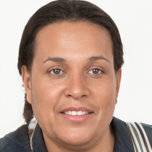 Joyful white adult female with short  brown hair and brown eyes