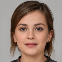 Neutral white young-adult female with medium  brown hair and brown eyes