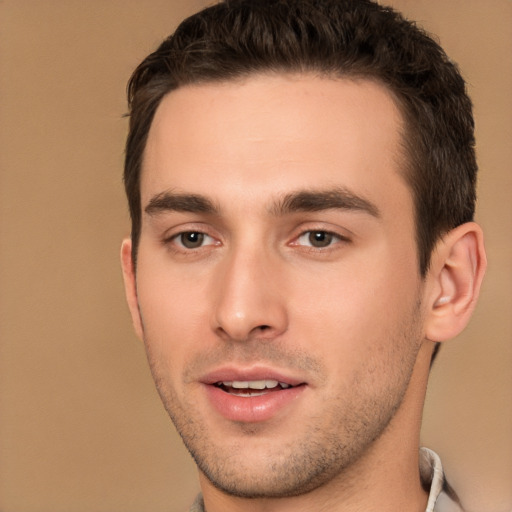 Joyful white young-adult male with short  brown hair and brown eyes