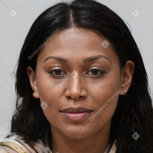 Joyful black adult female with long  brown hair and brown eyes