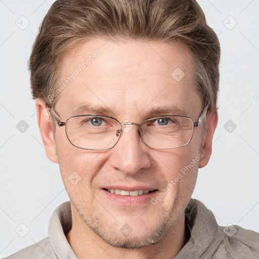 Joyful white adult male with short  brown hair and grey eyes