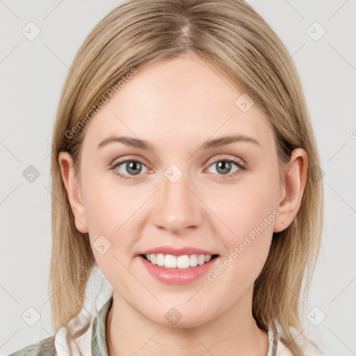 Joyful white young-adult female with medium  brown hair and grey eyes