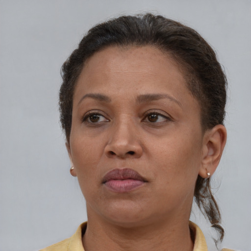 Neutral black adult female with short  brown hair and brown eyes