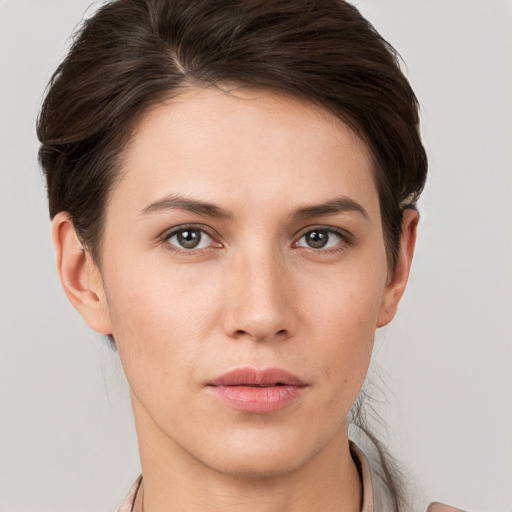 Neutral white young-adult female with short  brown hair and brown eyes