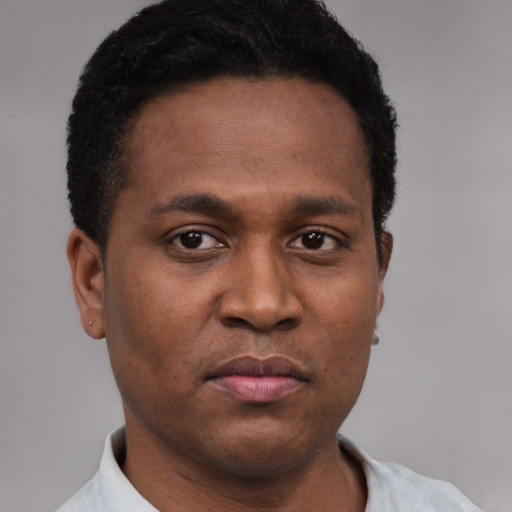 Neutral latino young-adult male with short  brown hair and brown eyes
