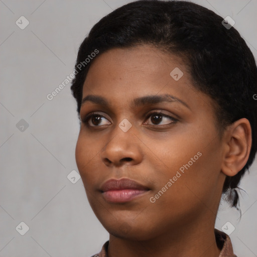 Neutral black young-adult female with short  black hair and brown eyes