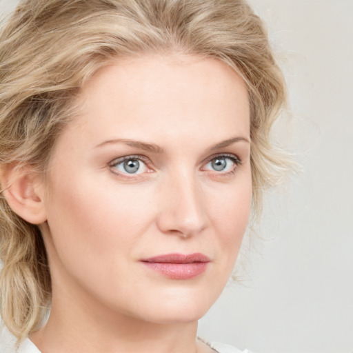 Joyful white young-adult female with long  brown hair and blue eyes