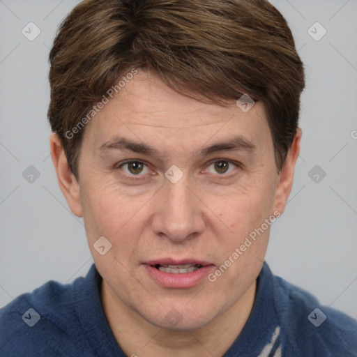 Joyful white adult male with short  brown hair and grey eyes