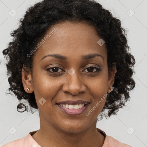 Joyful black young-adult female with medium  brown hair and brown eyes