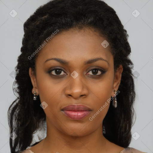 Joyful black young-adult female with long  brown hair and brown eyes