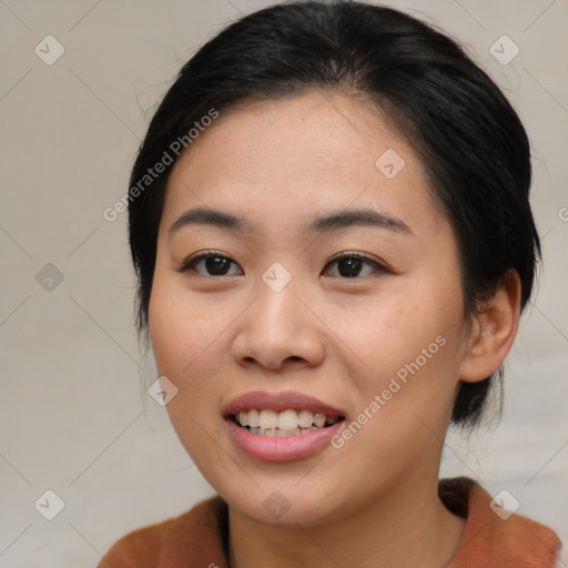 Joyful asian young-adult female with medium  black hair and brown eyes