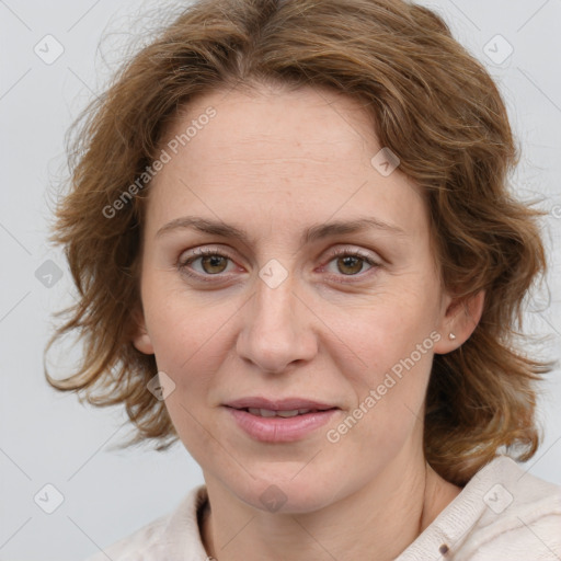 Joyful white adult female with medium  brown hair and blue eyes