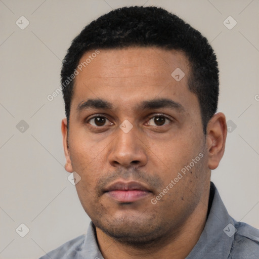 Neutral latino young-adult male with short  black hair and brown eyes