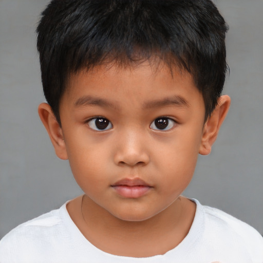 Neutral asian child male with short  brown hair and brown eyes