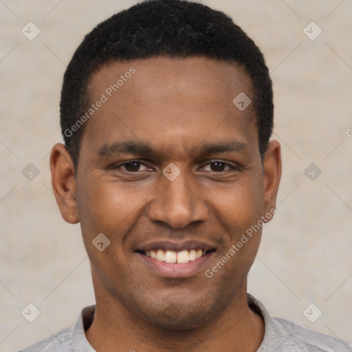 Joyful black young-adult male with short  black hair and brown eyes