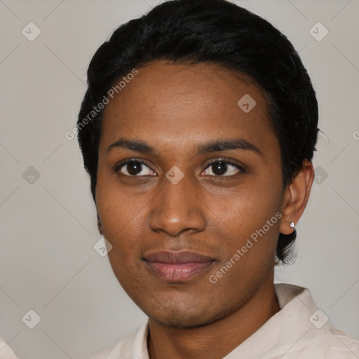 Joyful black young-adult female with short  black hair and brown eyes
